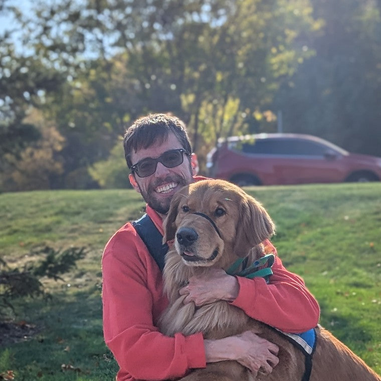 PuzzlePup founder Mike with his service dog Normie